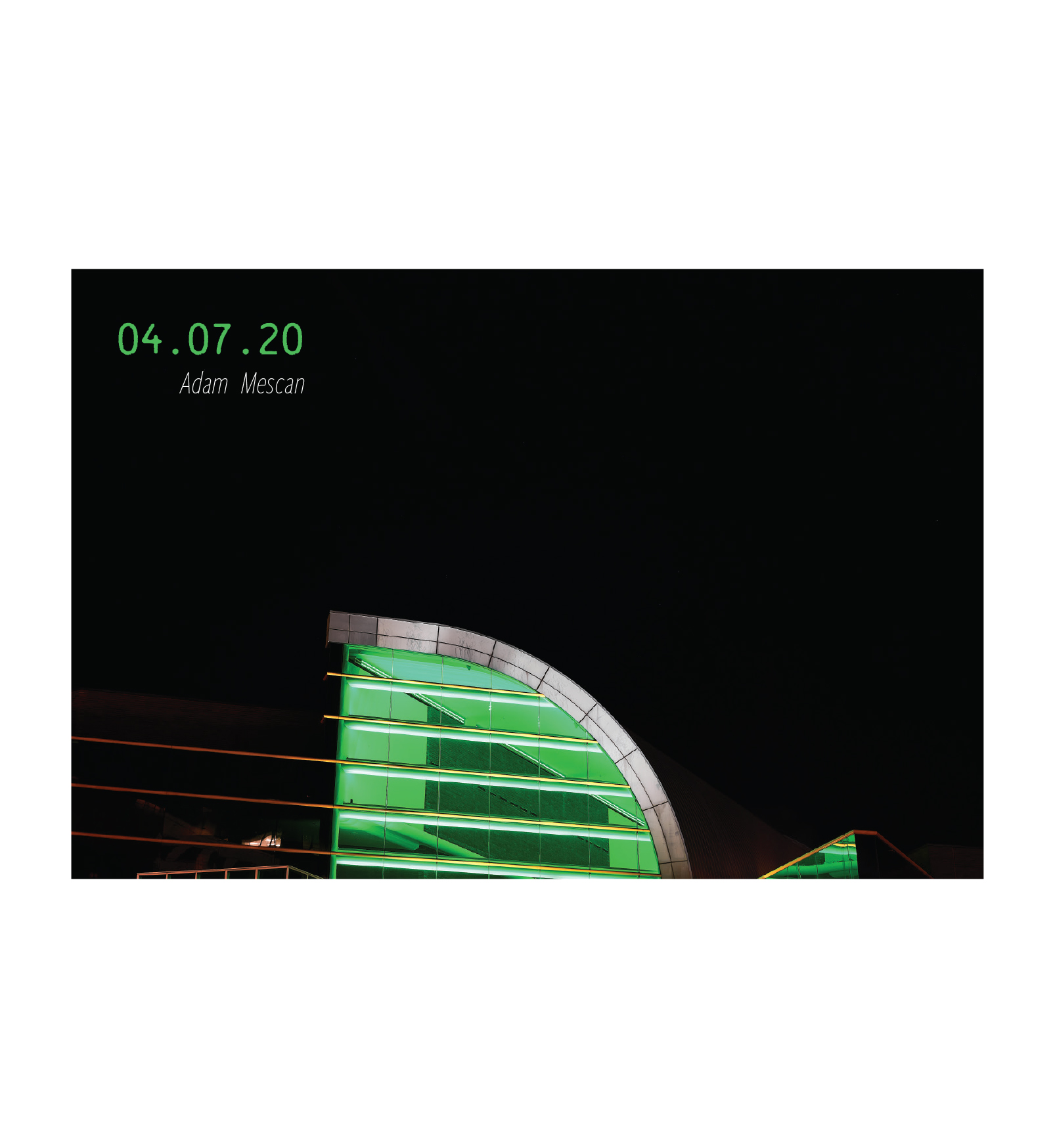 The top of the Kentucky Center, lit in green. 04.07.2020, by Adam Mescan