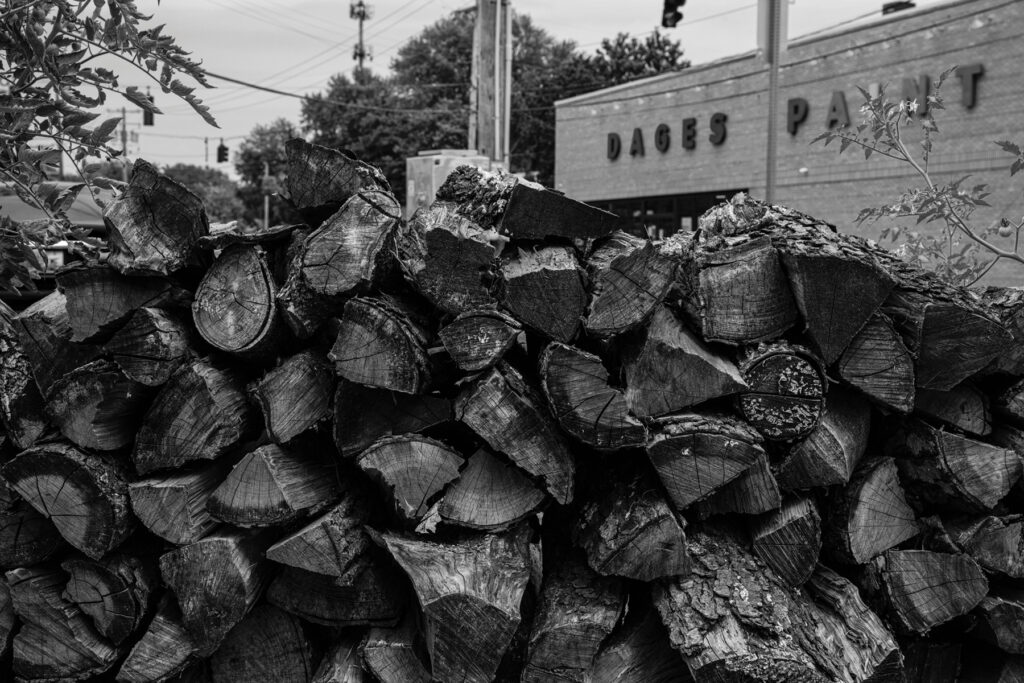 A pile of firewood at Full Stop (at “the Oak Street Wedge”).